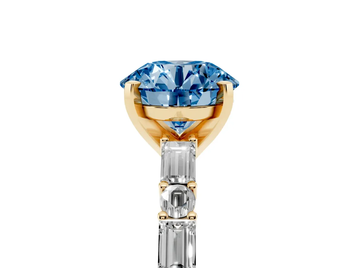 Fancy Blue Round Cut Diamond Solitaire with Side Baguettes and Channel Set Band Yellow gold