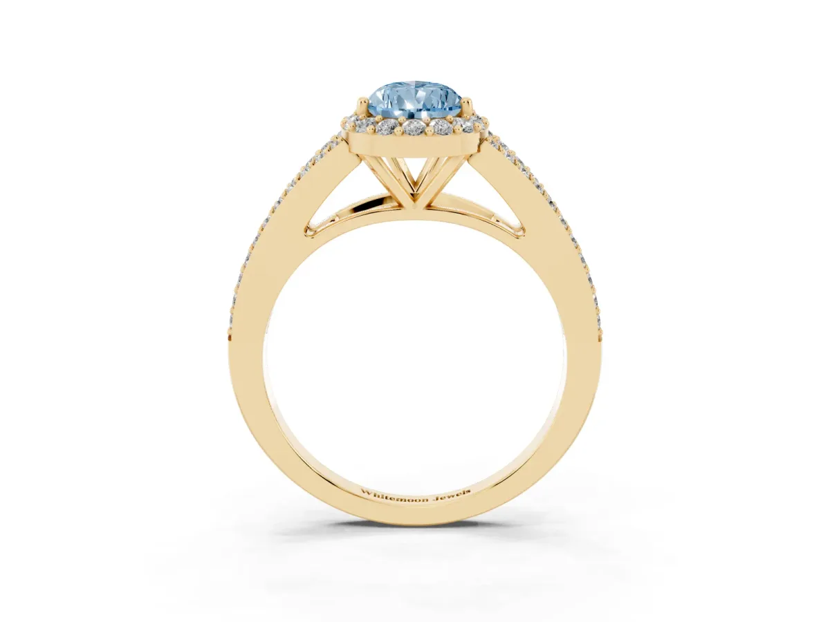 Fancy Blue Pear Cut Halo Split Shank Diamond Ring with Prong Setting Yellow gold