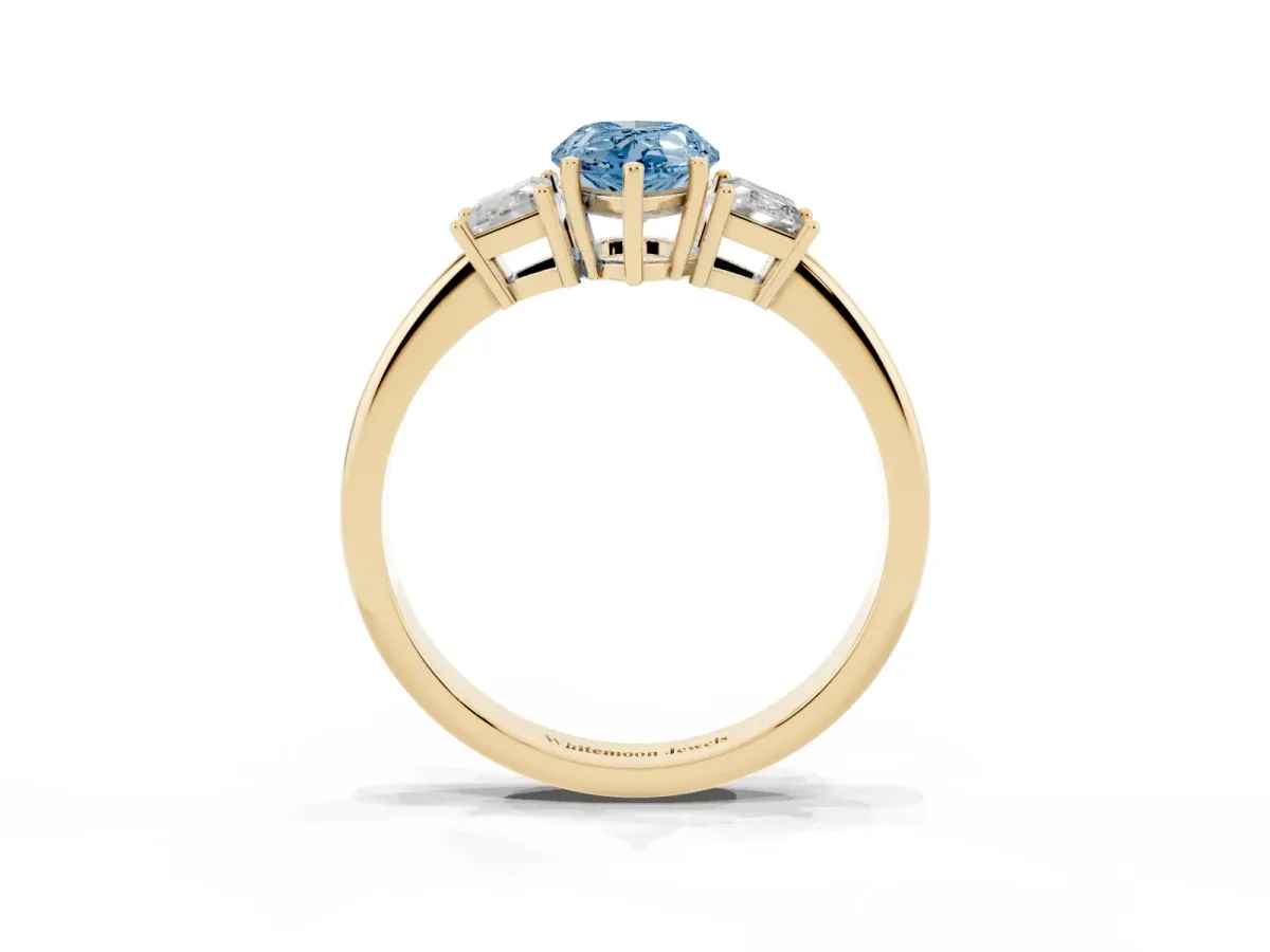 Fancy Blue Pear Cut Diamond Three-Stone Ring with Trapezoid Side Stones and Prong Setting Yellow gold