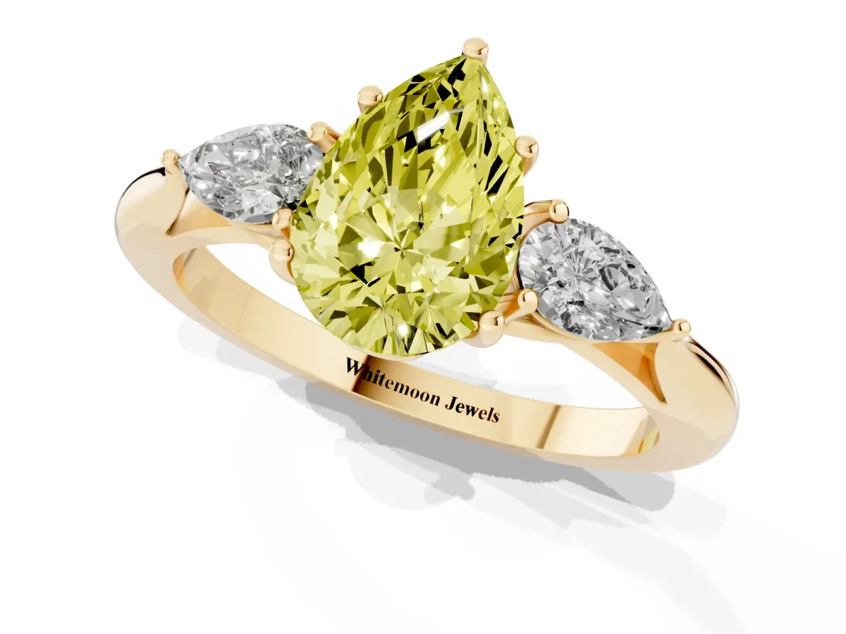 Fancy Yellow Three-Stone Pear Cut Diamond Ring with Pear Side Stones in Four-Prong Setting Yellow gold