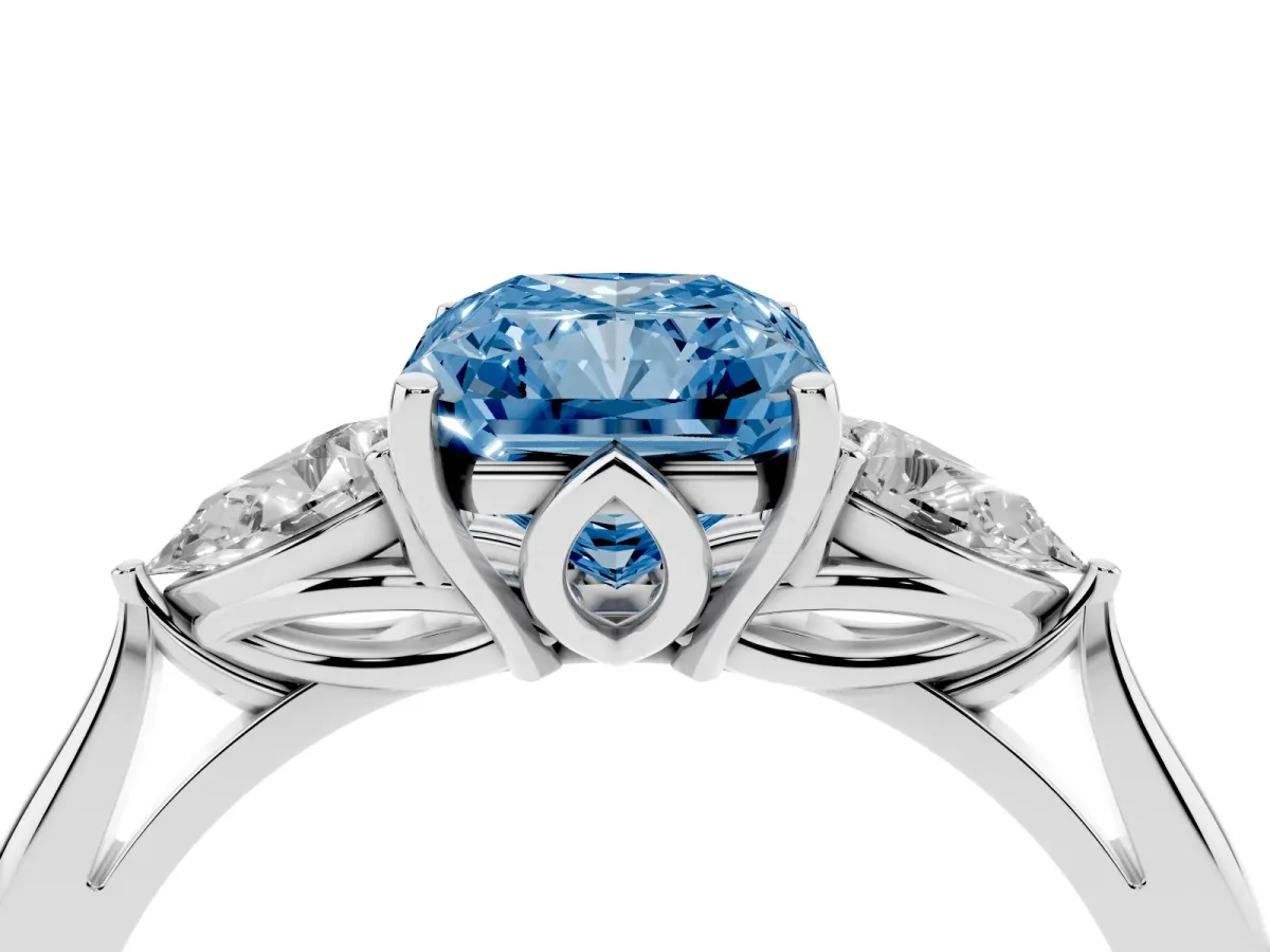 Fancy Blue Three-Stone Radiant Cut Diamond Ring with Pear Side Stones in Four-Prong Setting Platinum