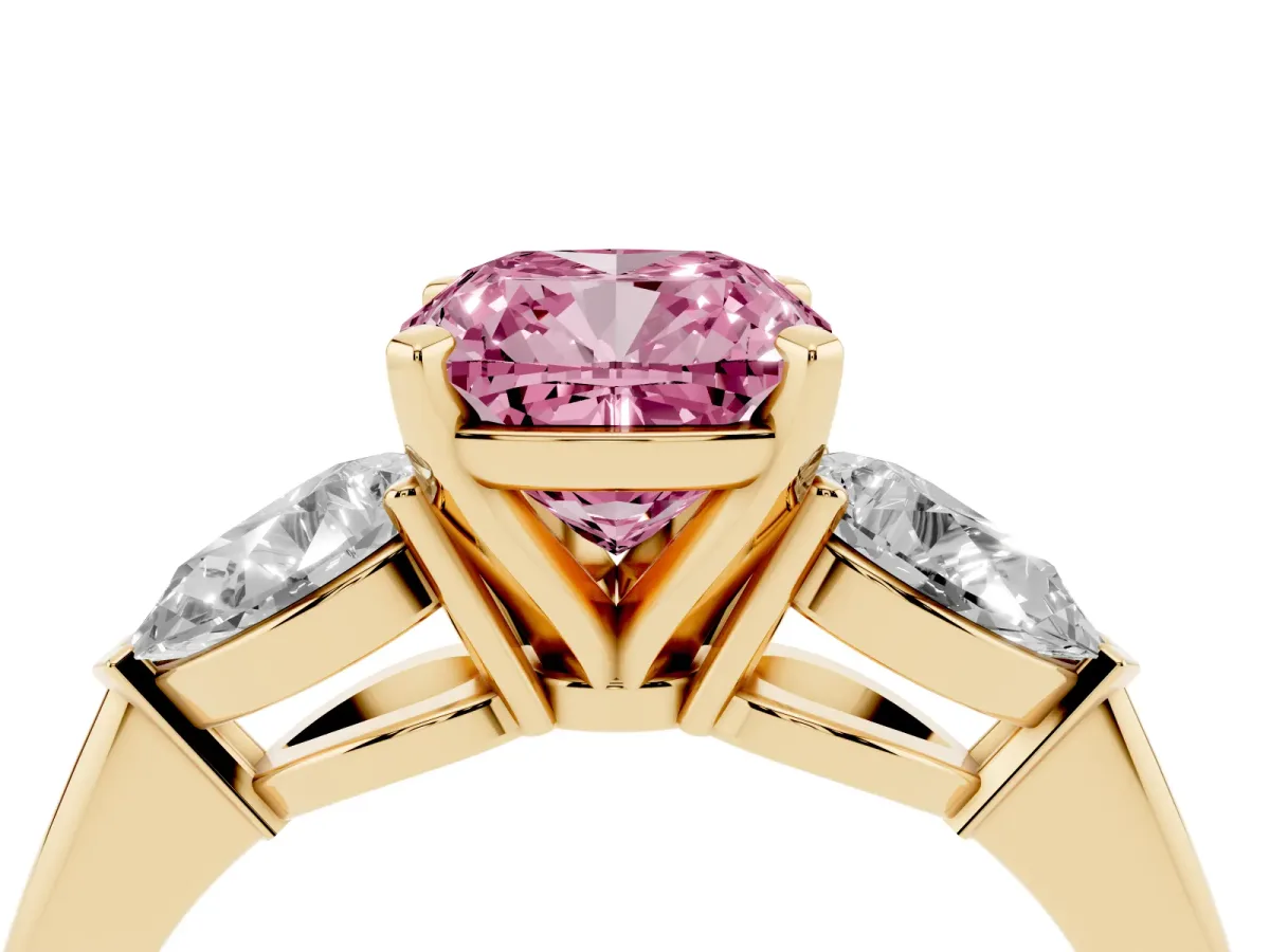 Fancy Pink Three-Stone Cushion Cut Diamond Ring with Pear Side Stones and Four-Prong Setting Yellow gold