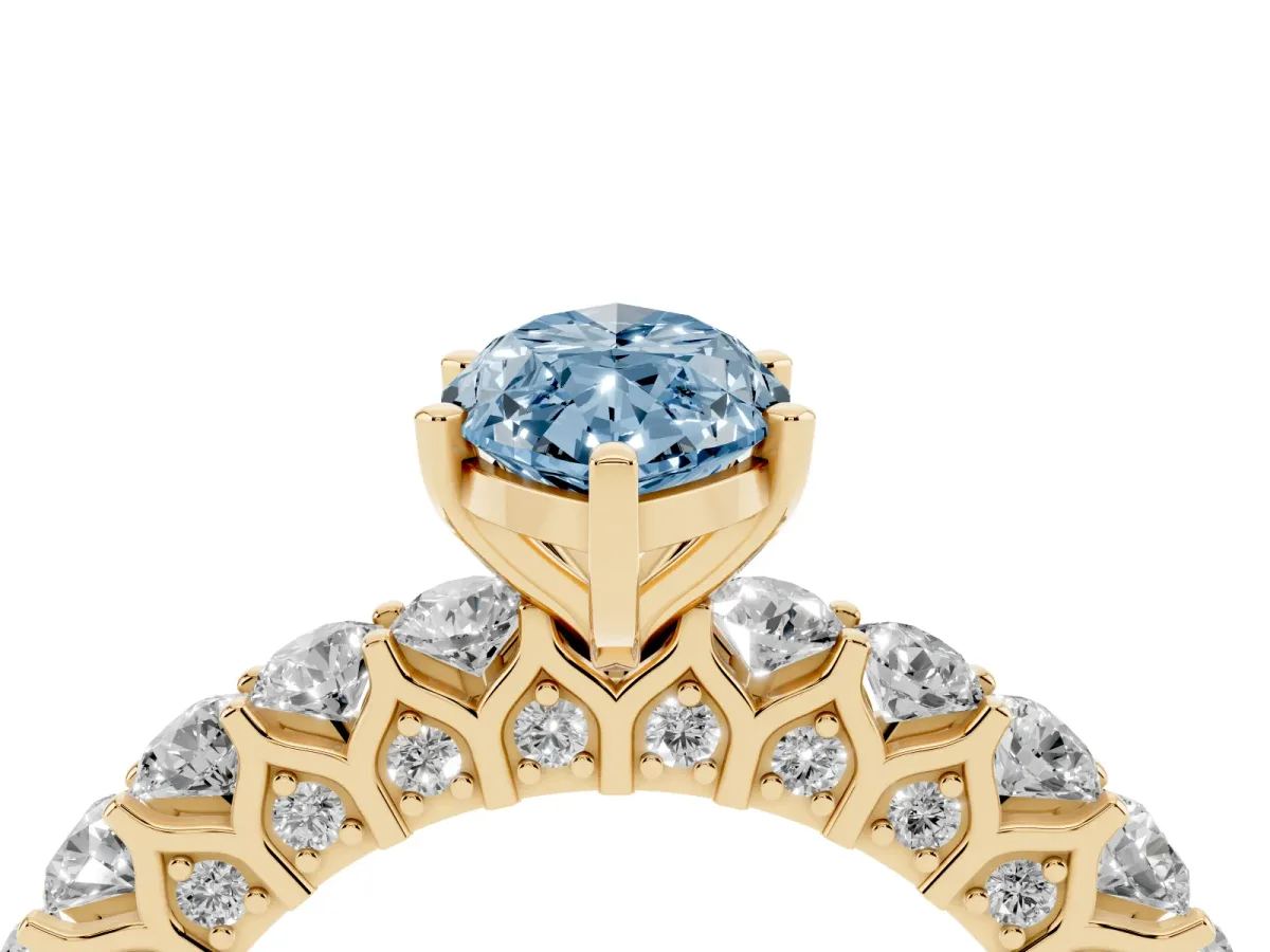Fancy Blue Marquise Cut Diamond Solitaire Ring with Shared Prong Pavé Band and Four-Prong Setting Yellow gold