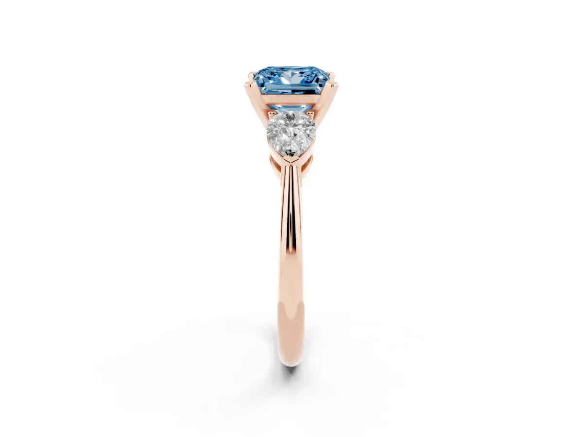 Fancy Blue Three-Stone Princess Cut Diamond Ring with Pear Side Stones and Four-Prong Setting Rose gold