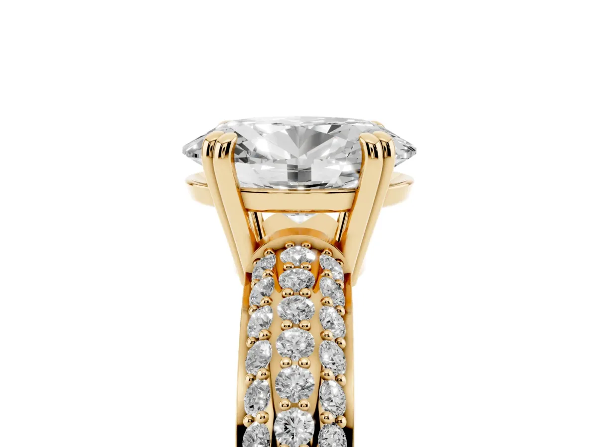 Oval Cut Diamond Solitaire Ring with Multi-Row Round Pavé Band and Prong Setting Yellow gold
