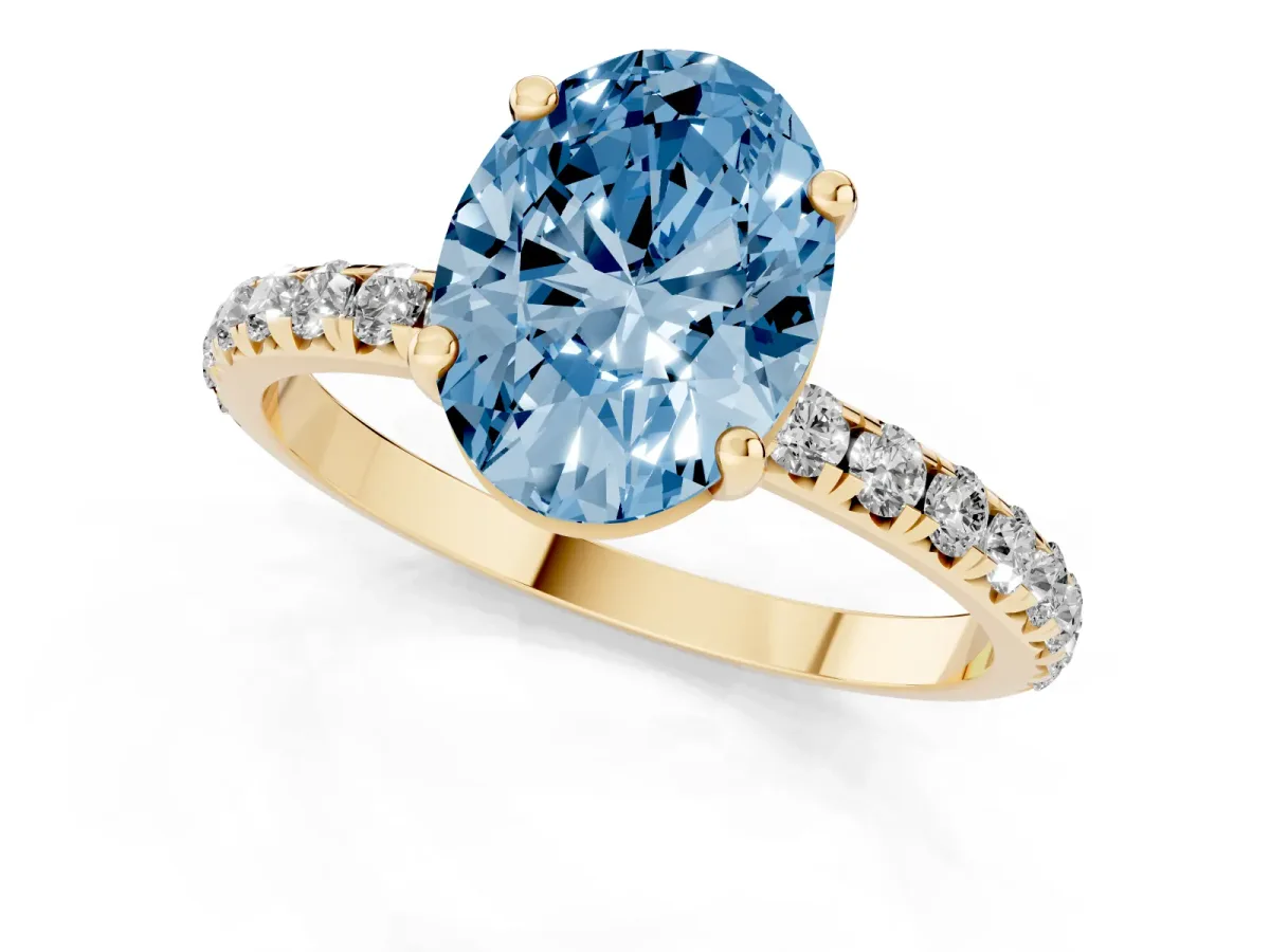 Fancy Blue Oval Cut Cut Diamond Solitaire Ring with Micro Pave Band and Four Prong Setting Yellow gold