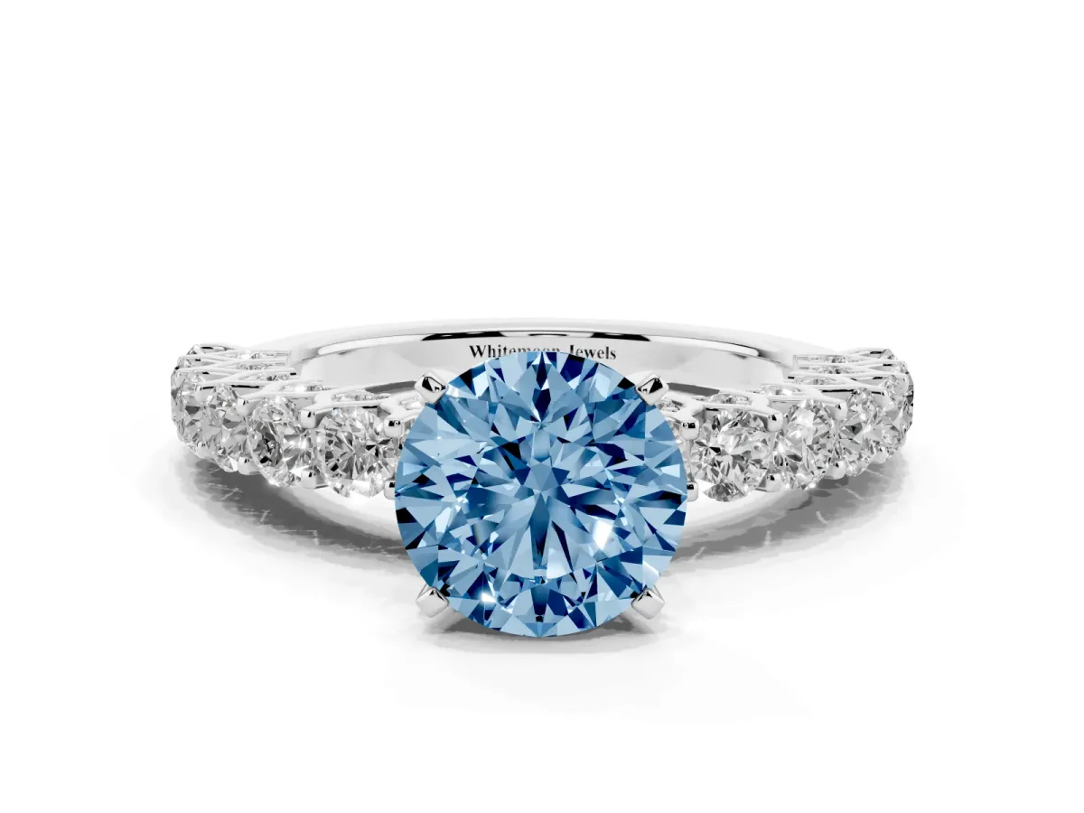 Fancy Blue Round Cut Diamond Solitaire Ring with Shared Prong Pavé Band and Four-Prong Setting Silver