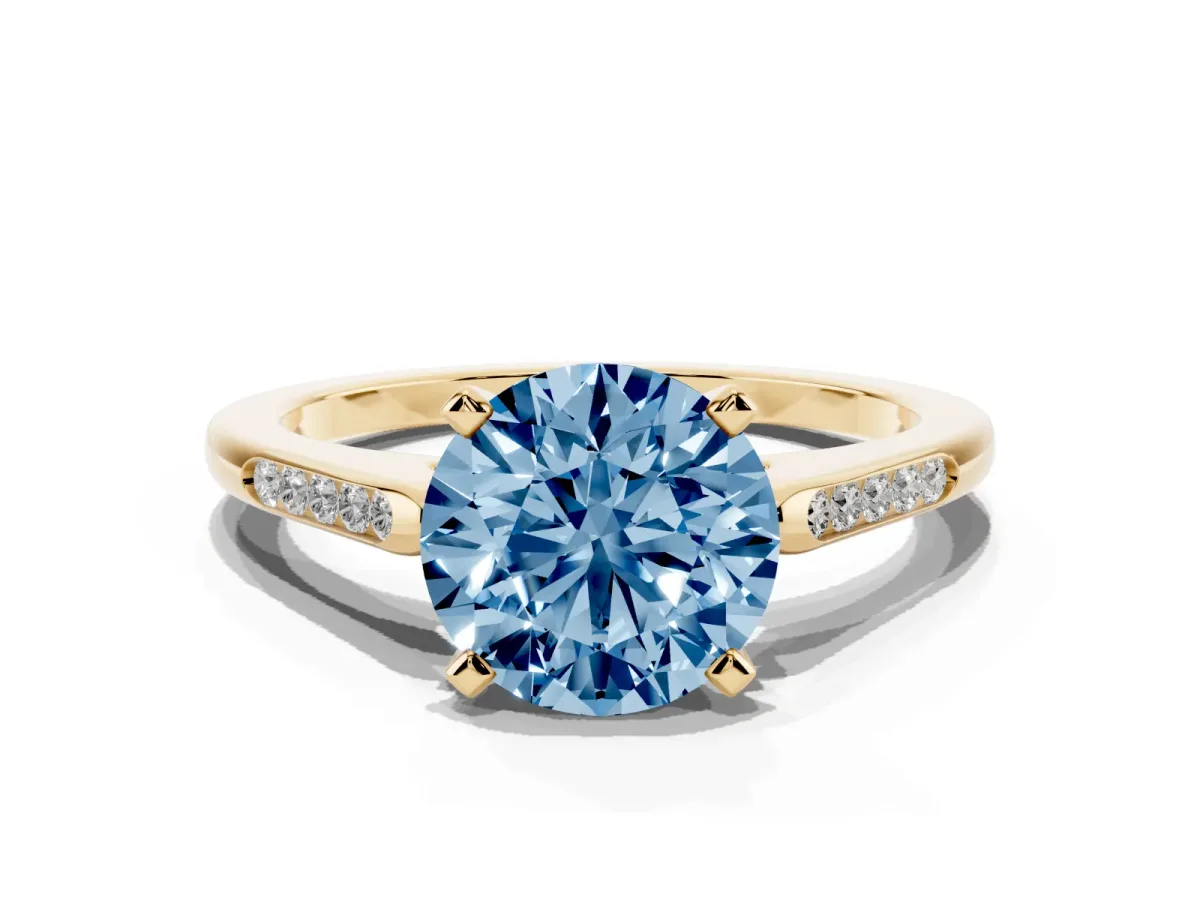 Fancy Blue Round Cut Diamond Solitaire Ring with Channel Set Round Band and Prong Setting Yellow gold