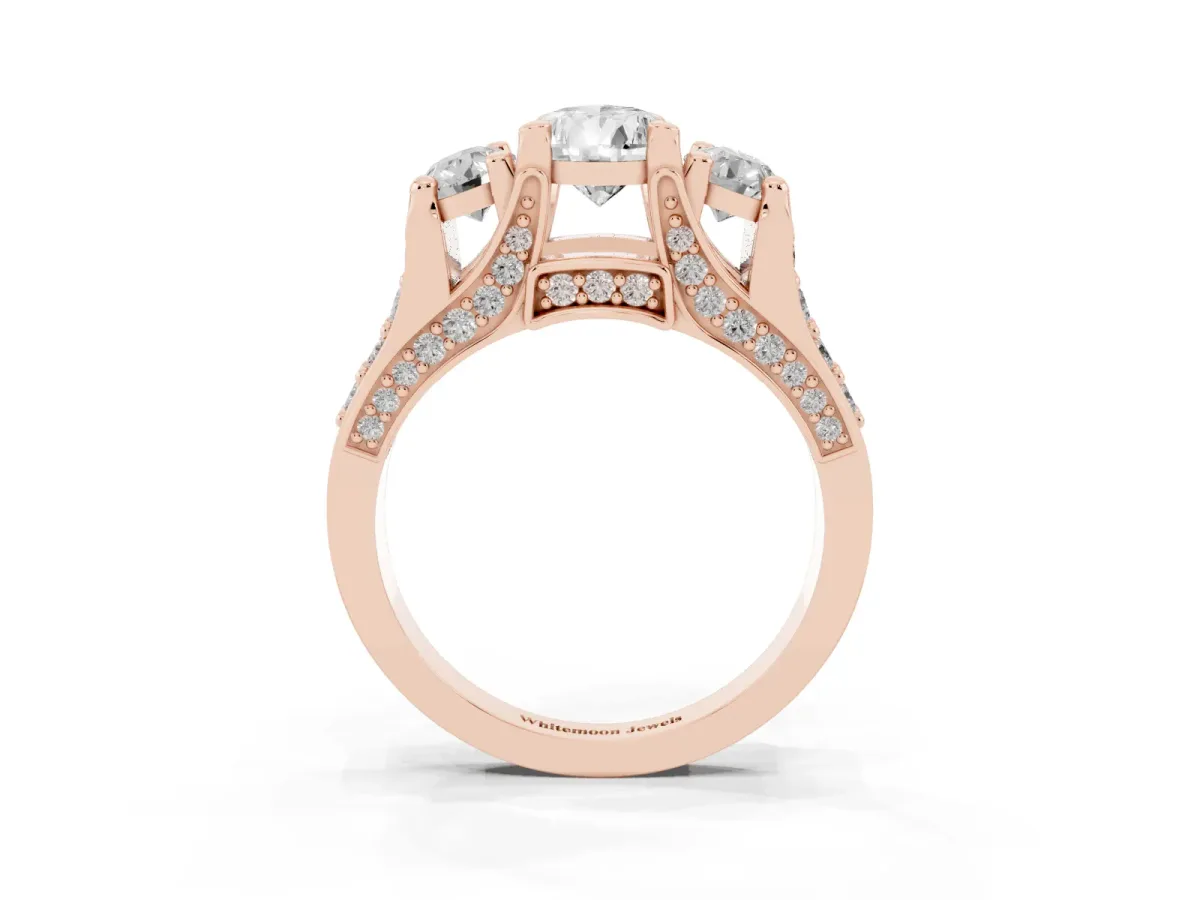 Pear Cut Diamond Three-Stone Ring with Channel Set Band and Four-Prong Setting Rose gold