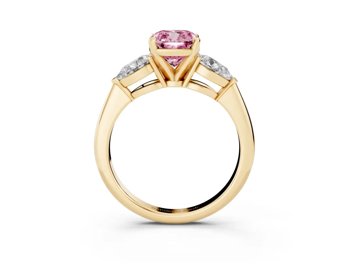 Fancy Pink Three-Stone Cushion Cut Diamond Ring with Pear Side Stones and Four-Prong Setting Yellow gold