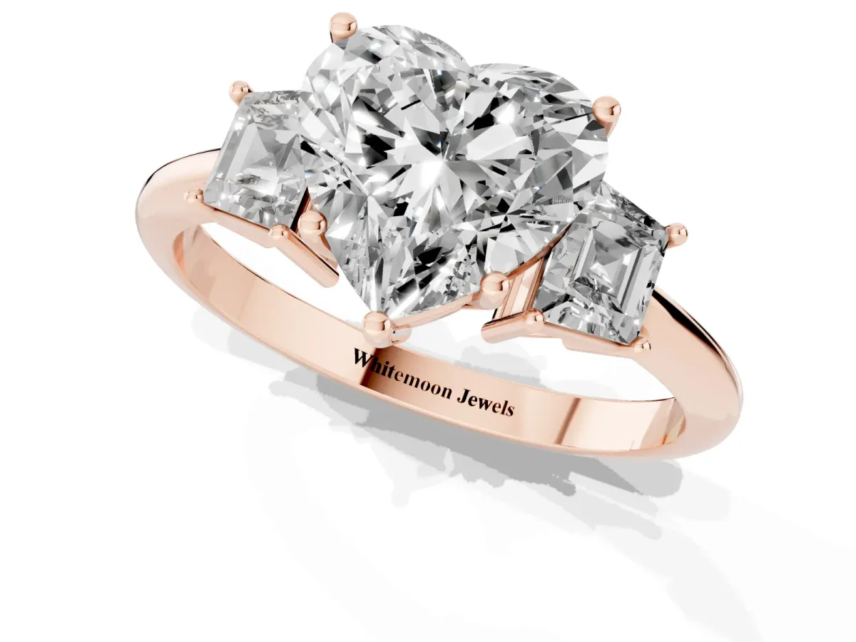 Heart Cut Diamond Three-Stone Ring with Trapezoid Side Stones and Prong Setting Rose gold