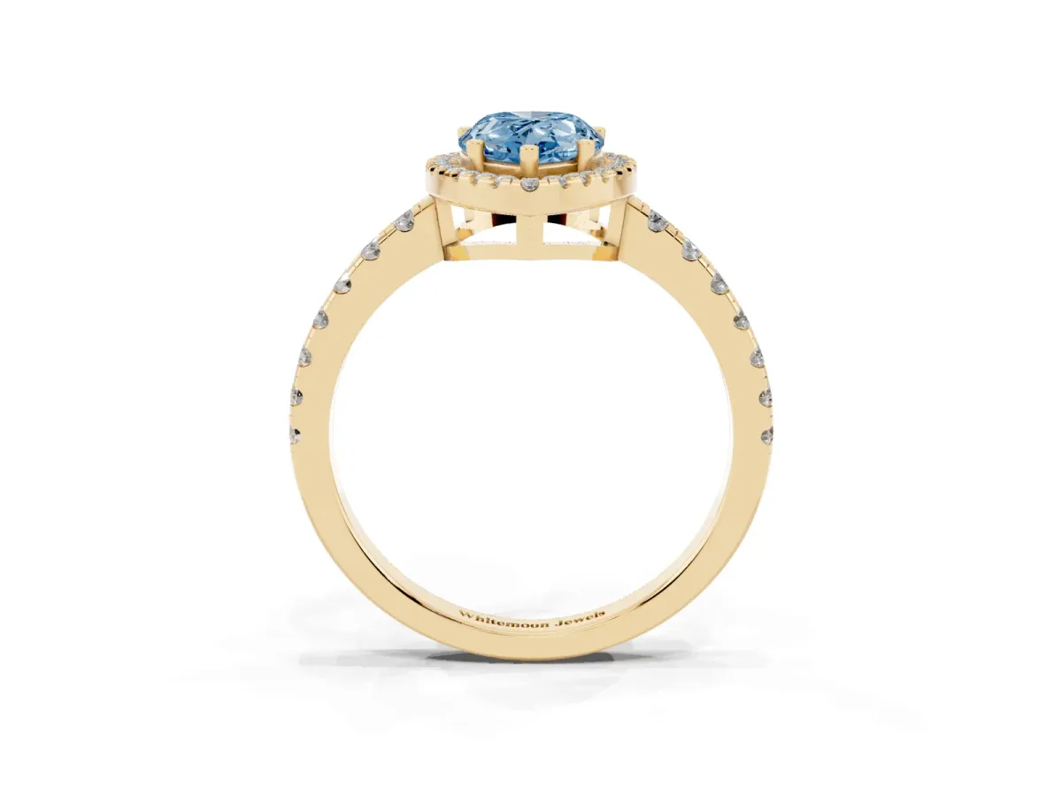 Fancy Blue Pear Cut Diamond Halo Ring with Pavé Band and Four-Prong Setting Yellow gold