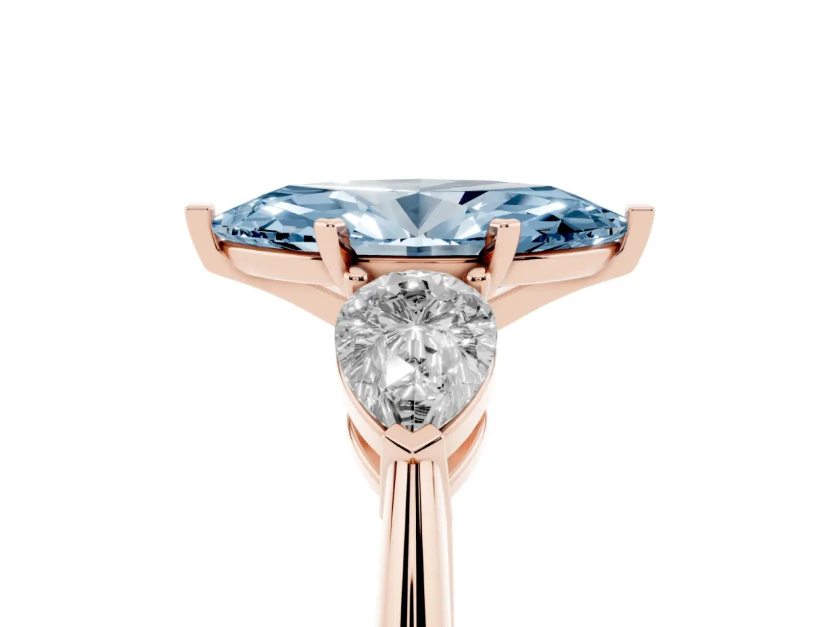 Fancy Blue Three-Stone Marquise Cut Diamond Ring with Pear Side Stones and Four-Prong Setting Rose gold