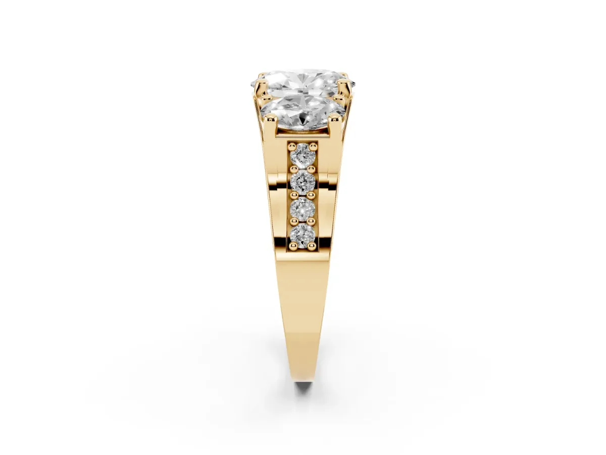 Oval Cut Diamond Three-Stone Ring with Channel Set Band and Four-Prong Setting Yellow gold