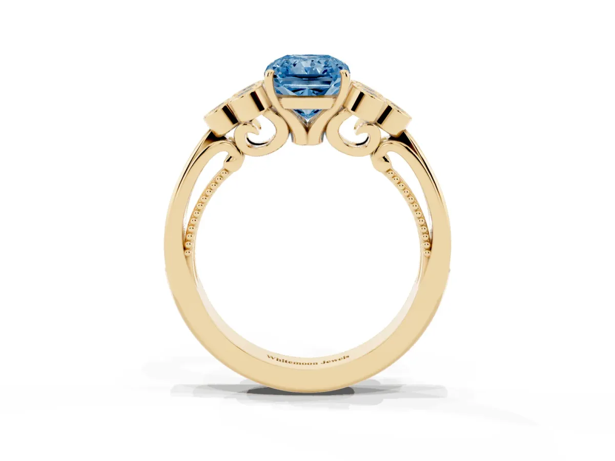 Fancy Blue Radiant Cut Cut Diamond Engagement Ring with Bezel Set Round Side Stones and Prong Setting Yellow gold
