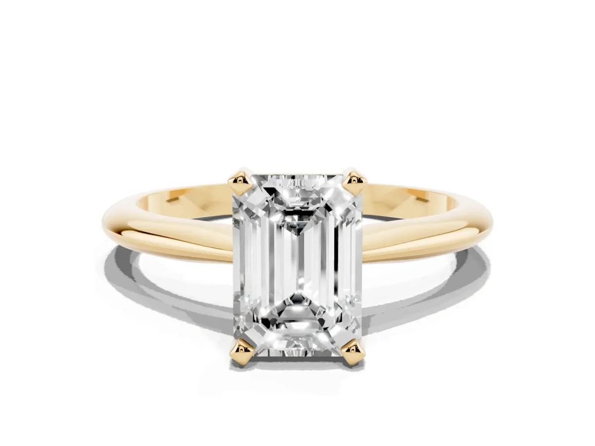 Emerald Cut Cut Solitaire Ring with Four-Prong Setting on a Classic Band Yellow gold