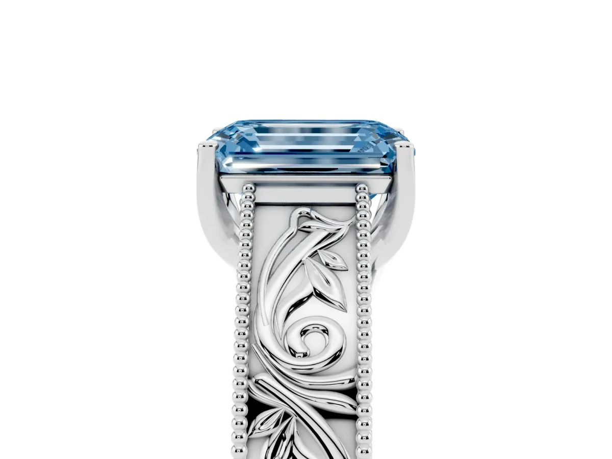 Fancy Blue Emerald Cut Diamond Solitaire Ring with Engraved Band and Four-Prong Setting Platinum
