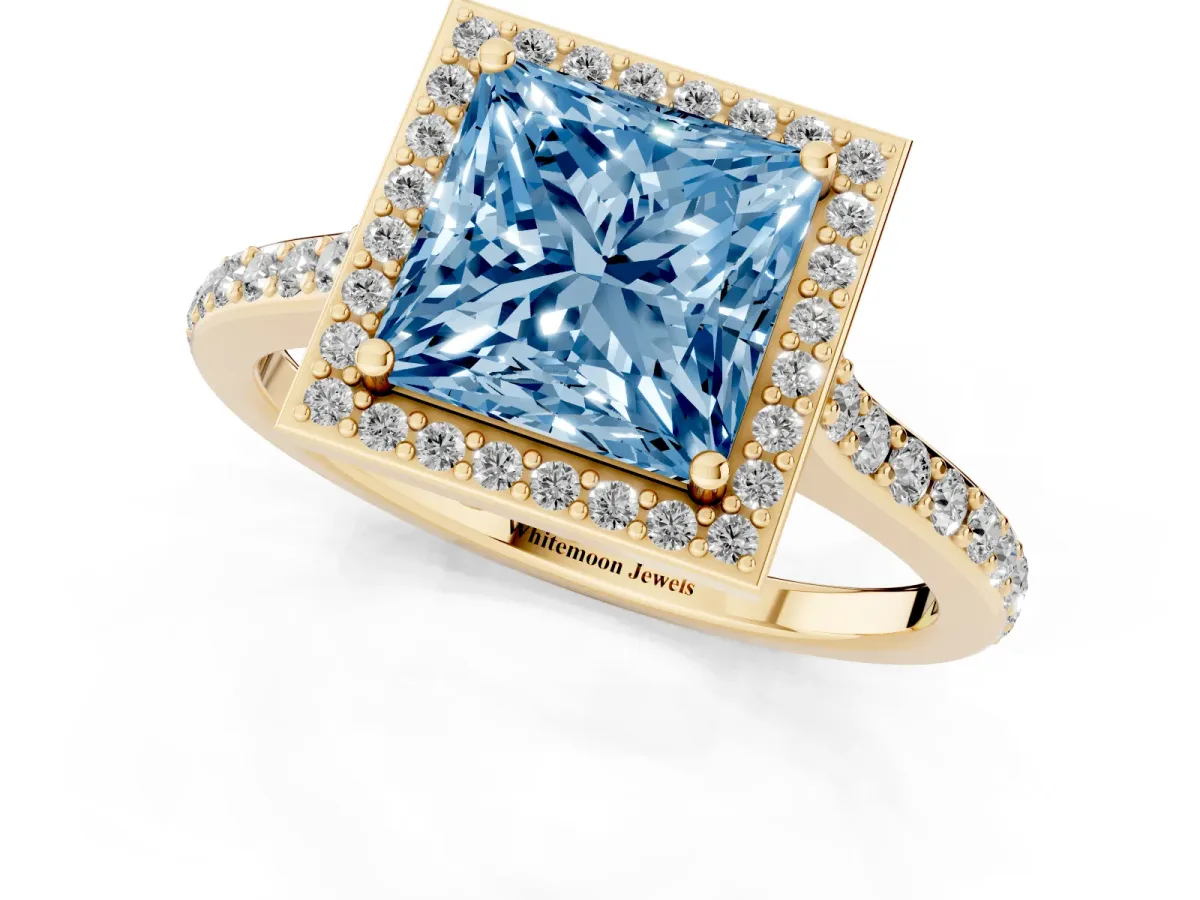 Fancy Blue Princess Cut Diamond Halo Engagement Ring with Round Pavé Shoulders and Prong Setting Yellow gold