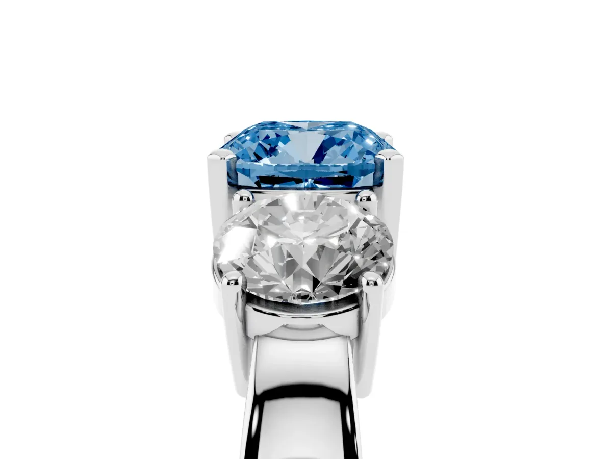 Fancy Blue Three-Stone Cushion Cut Diamond Ring with Round Side Stones, Classic Band, and Four-Prong Setting White gold