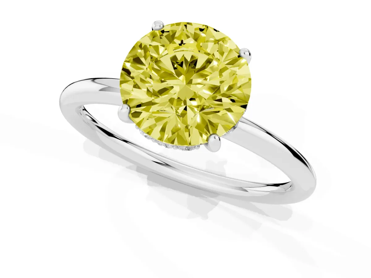 Fancy Yellow Round Cut Solitaire Diamond Ring with a Classic Band and Four-Prong Setting Silver