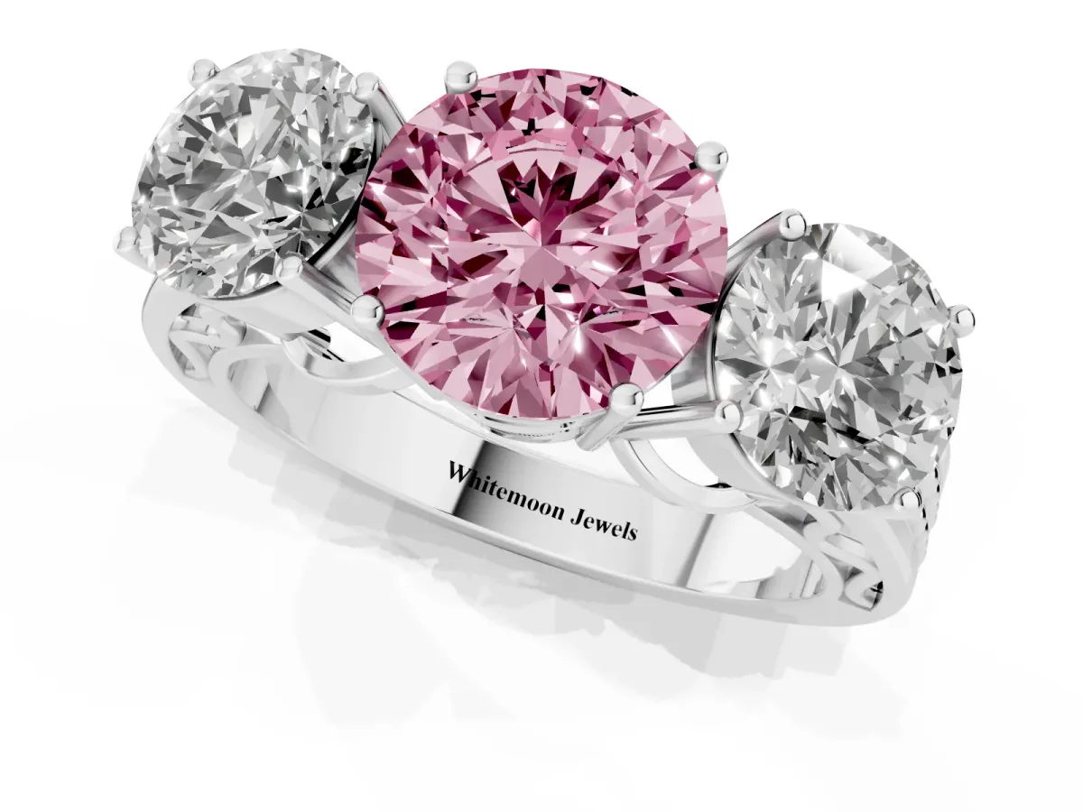 Fancy Pink Round Cut Diamond Three-Stone Ring with Prong Setting and Textured Band Platinum