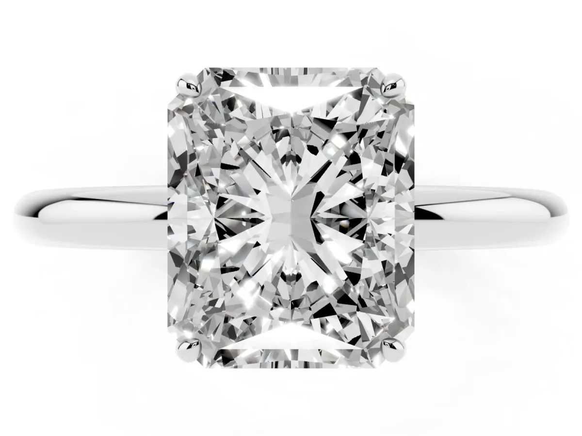 Radiant Cut Solitaire Diamond Ring with Four-Prong Setting on a Plain Band Platinum