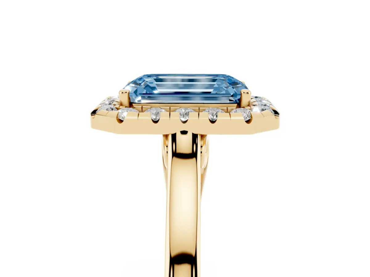 Fancy Blue Emerald Cut Halo Round Diamond Solitaire Ring with Pavé Band and Four-Prong Setting Yellow gold