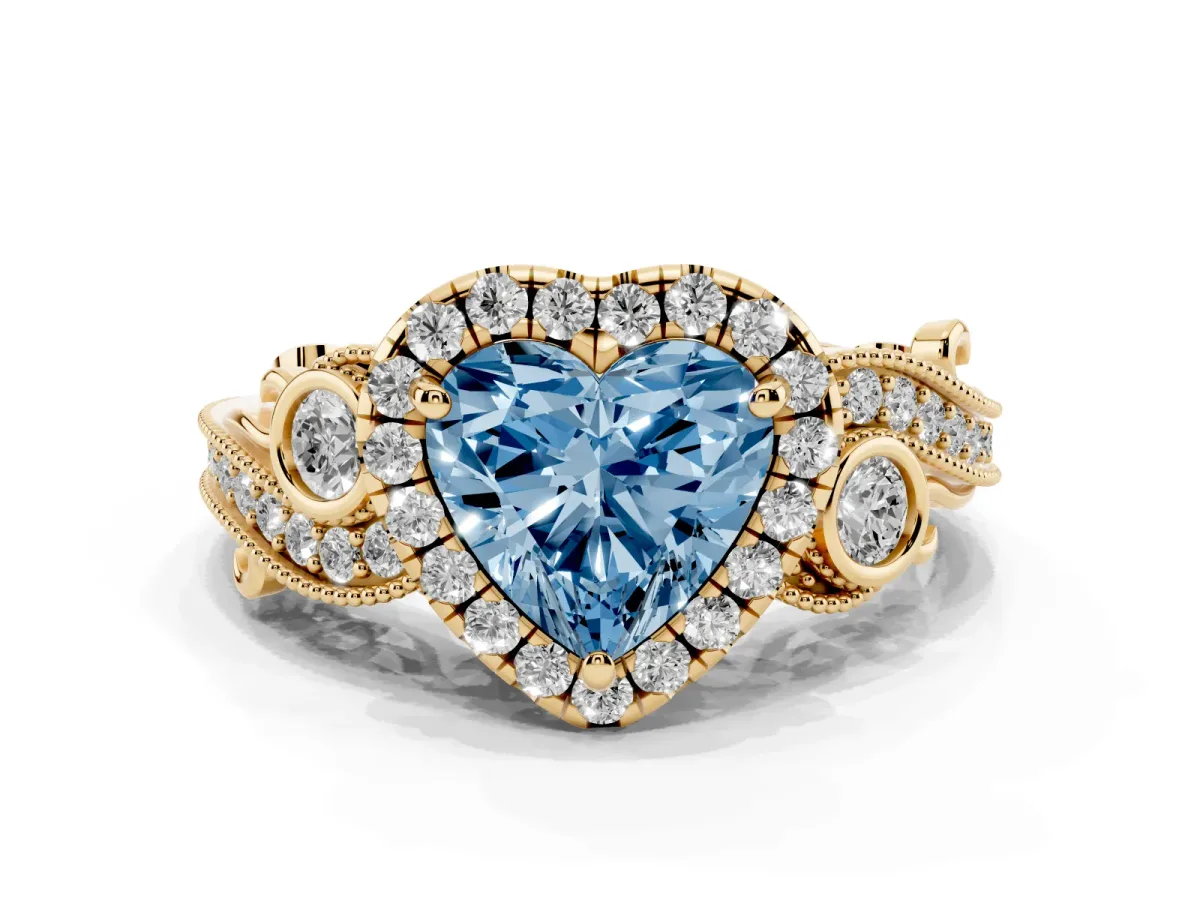 Fancy Blue Heart Cut Halo Diamond Ring with Milgrain and Bezel Accents on a Split Shank Band Yellow gold