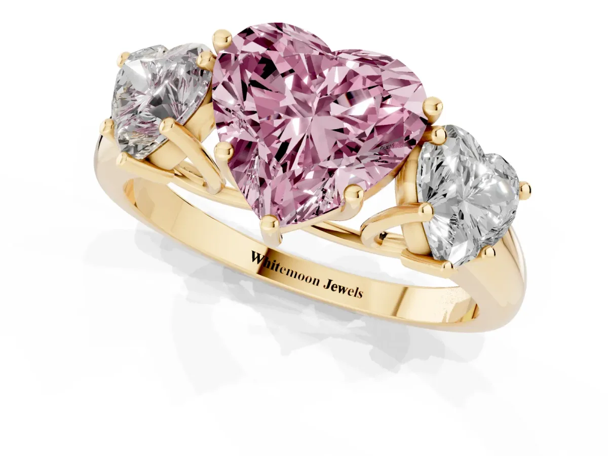 Fancy Pink Three-Stone Heart Cut Diamond Engagement Ring with Prong Setting Yellow gold