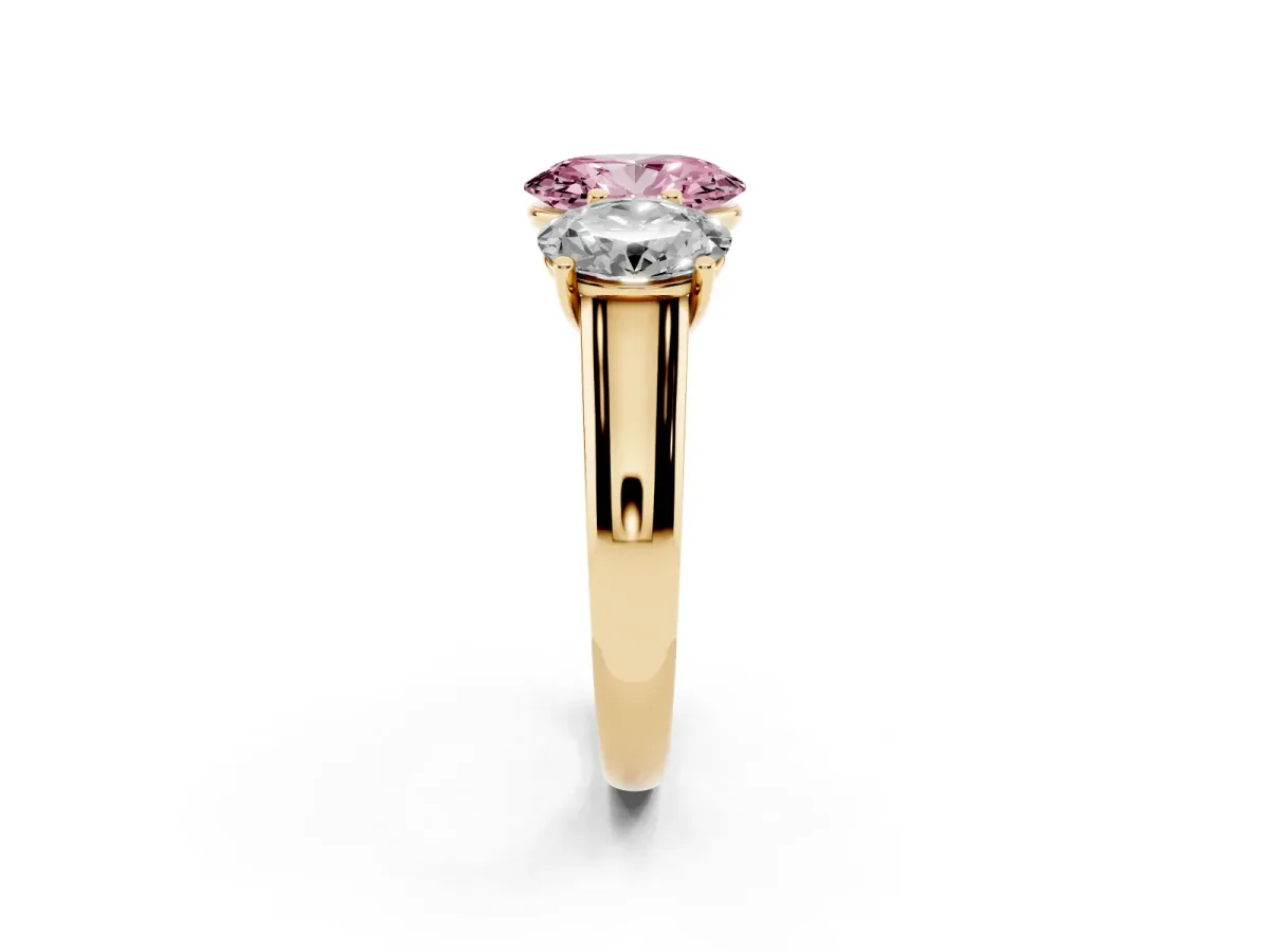 Fancy Pink Oval Cut Three-Stone Diamond Ring with Prong Setting on a Classic Band Yellow gold