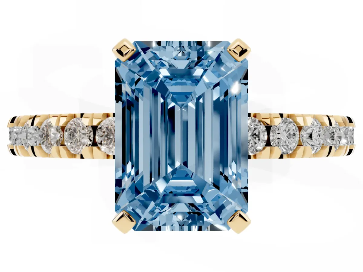 Fancy Blue Emerald Cut Diamond Pavé Band Solitaire with Four-Prong Setting Yellow gold