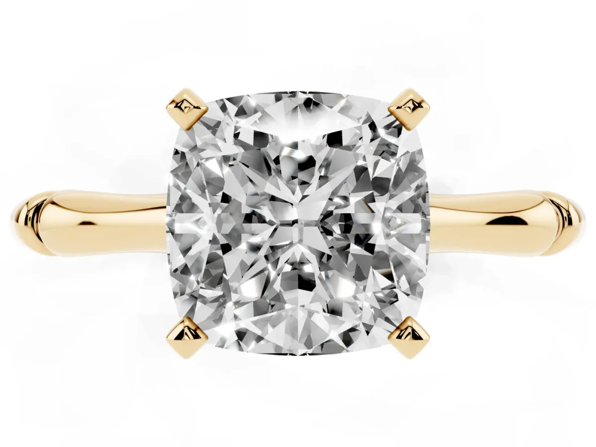 Cushion Cut Solitaire Diamond Ring with Bamboo Band and Four-Prong Setting Yellow gold