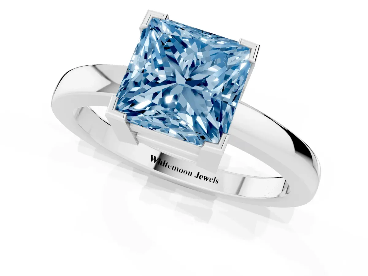 Fancy Blue Princess Cut Cut Solitaire Ring with Four-Prong Setting and Classic Band Silver