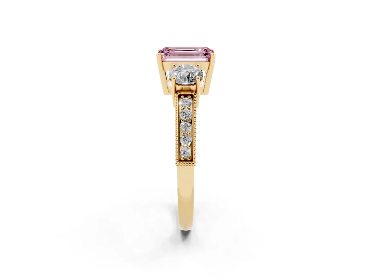 Fancy Pink Emerald Cut Three-Stone Diamond Ring with Pavé Band and Four-Prong Setting Yellow gold