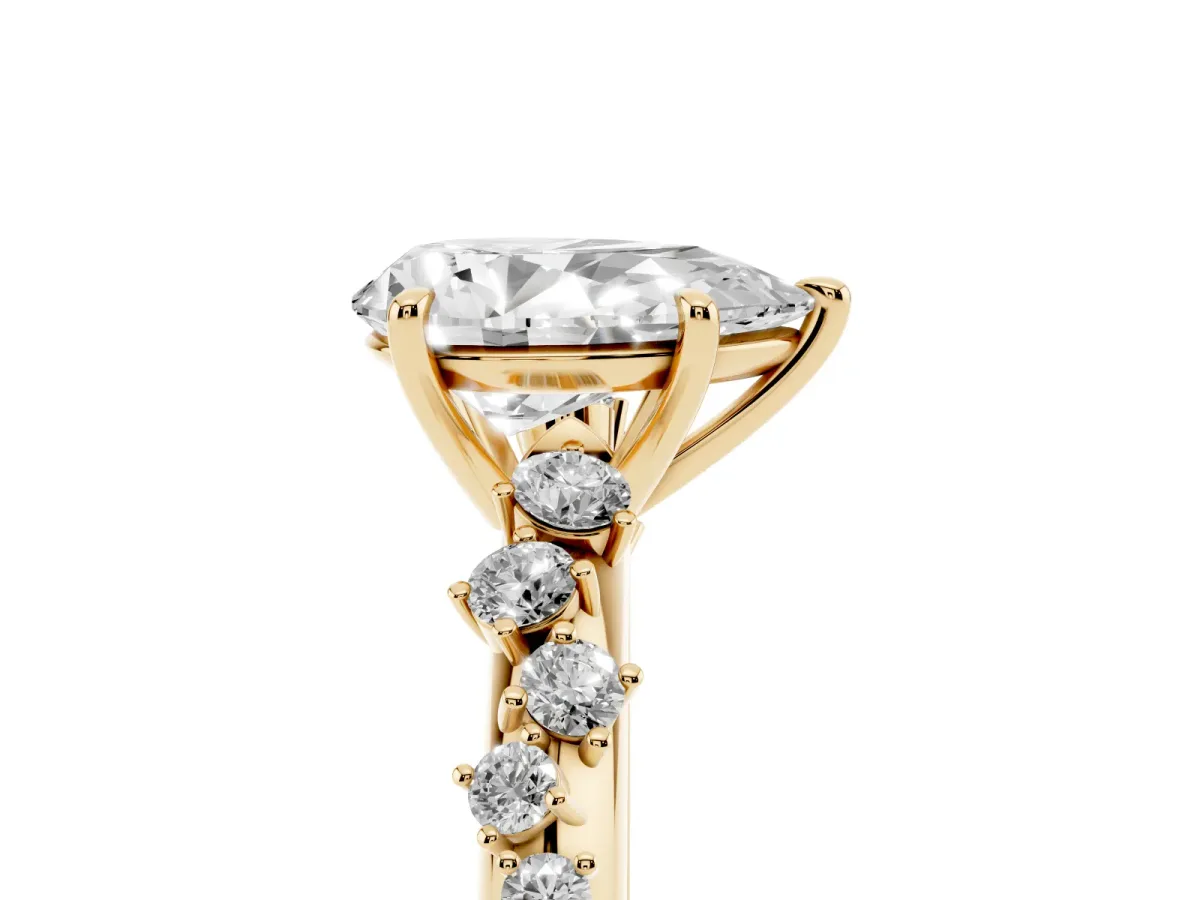 Pear Cut Diamond Cluster Side Stone Solitaire Ring with Prong Setting Yellow gold