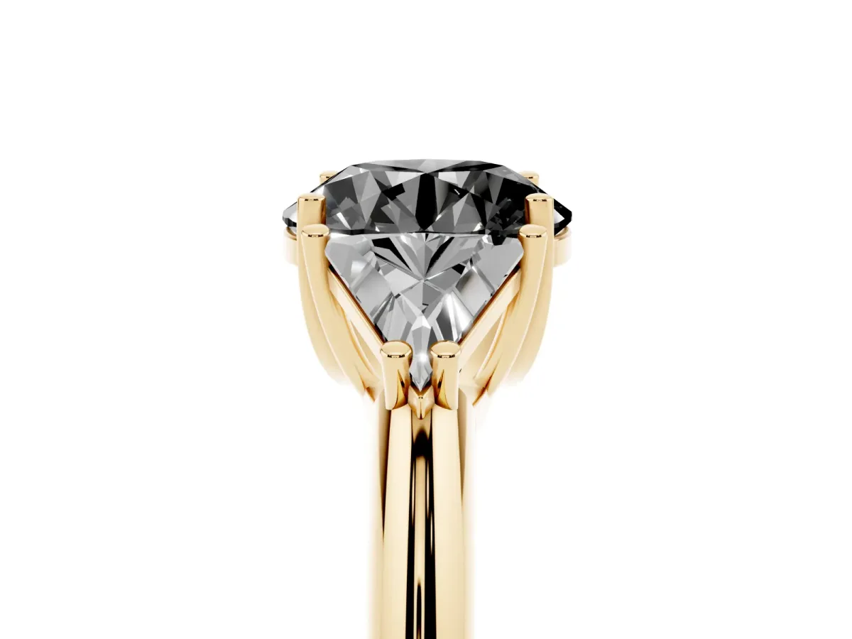 Fancy Black Three-Stone Round Cut Diamond Engagement Ring with Trillion Side Stones and Prong Setting Yellow gold