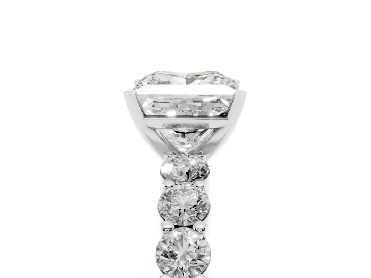 Princess Cut Diamond Solitaire Ring with Shared Prong Round Side Stones Silver