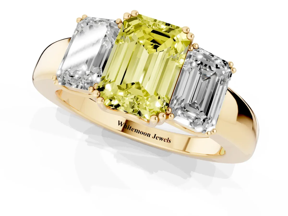 Fancy Yellow Three-Stone Emerald Cut Cut Diamond Ring with Channel Set Band and Four-Prong Setting Yellow gold