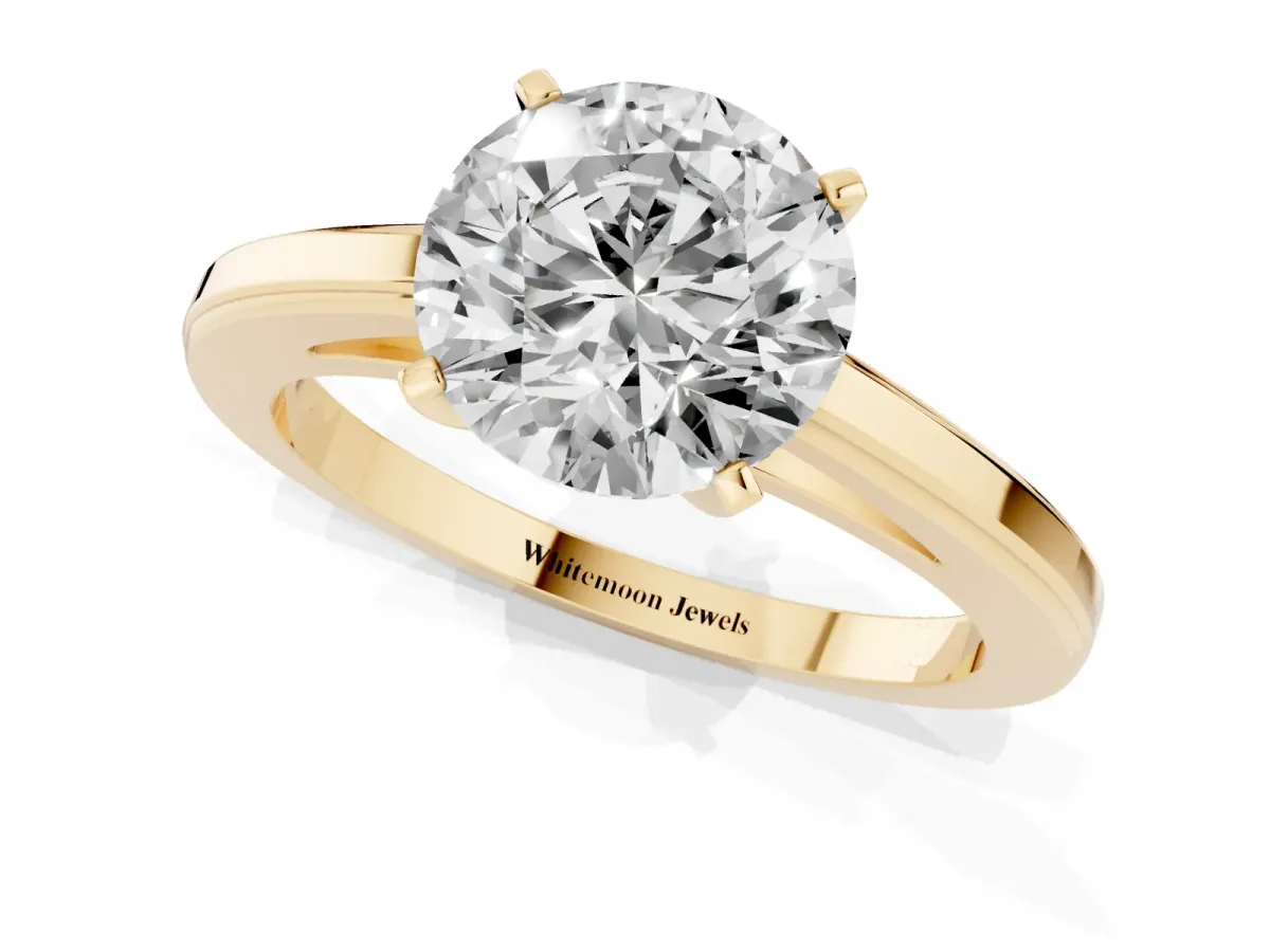 Round Cut Solitaire Diamond Ring with Four-Prong Setting and Classic Band Yellow gold
