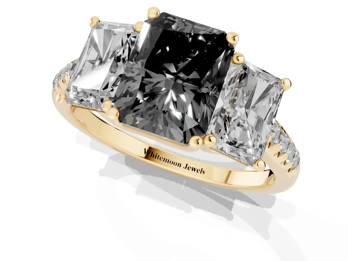 Fancy Black Three-Stone Radiant Cut Diamond Ring with Round Pavé Band and Prong Setting Yellow gold