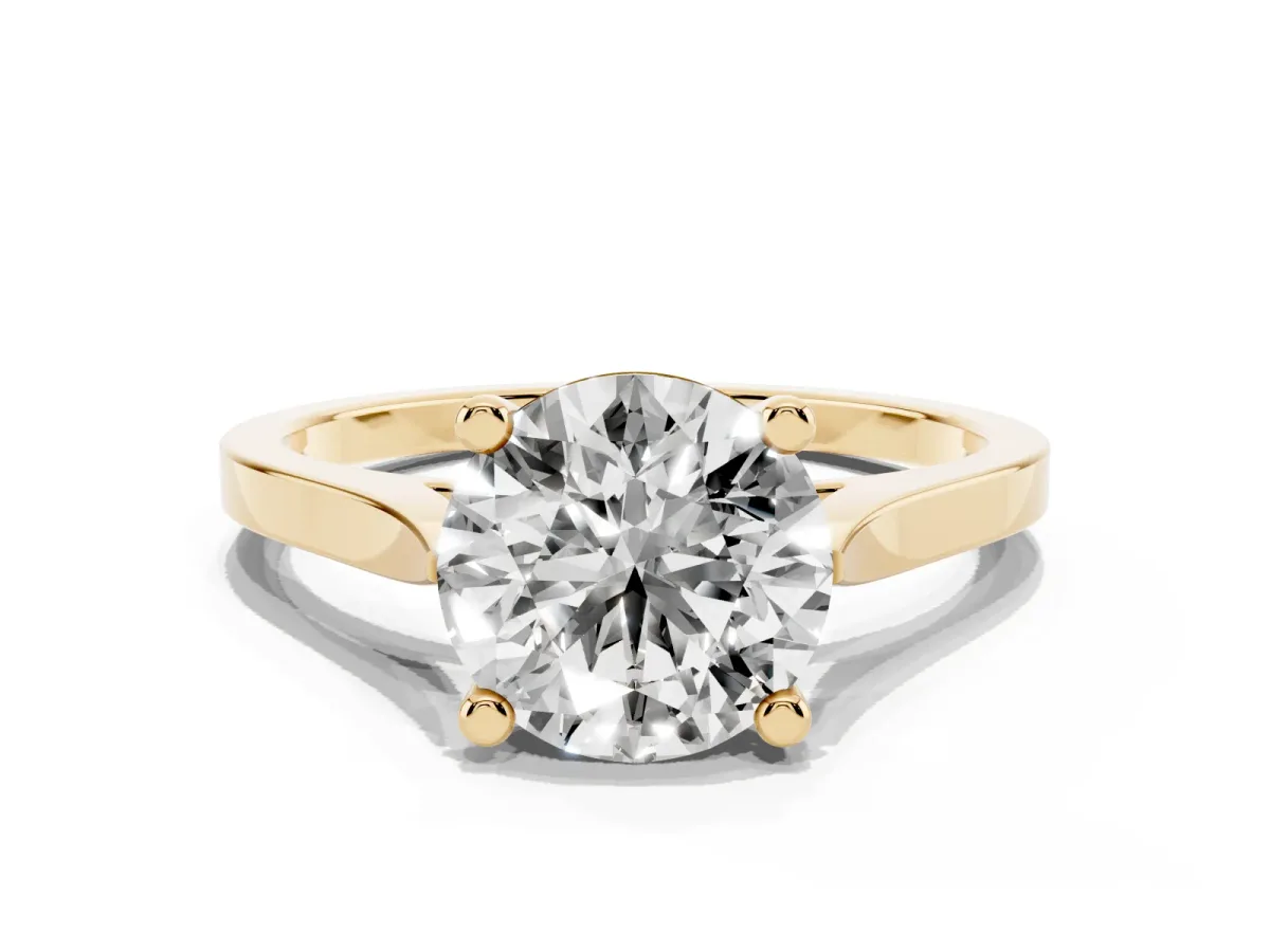 Round Cut Solitaire Diamond Ring with Four-Prong Setting and Tapered Band Yellow gold