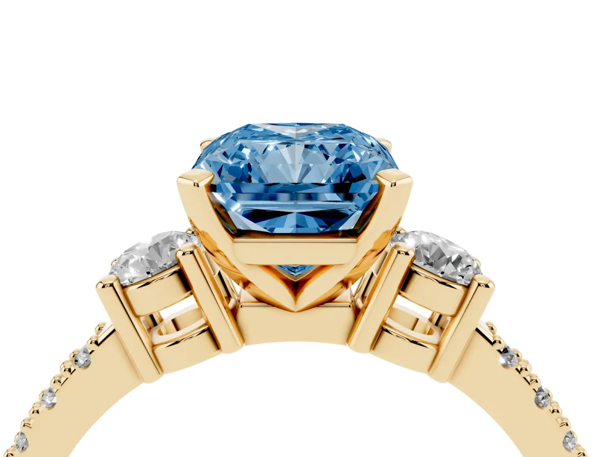 Fancy Blue Radiant Cut Three-Stone Diamond Pavé Band with Prong Setting Yellow gold