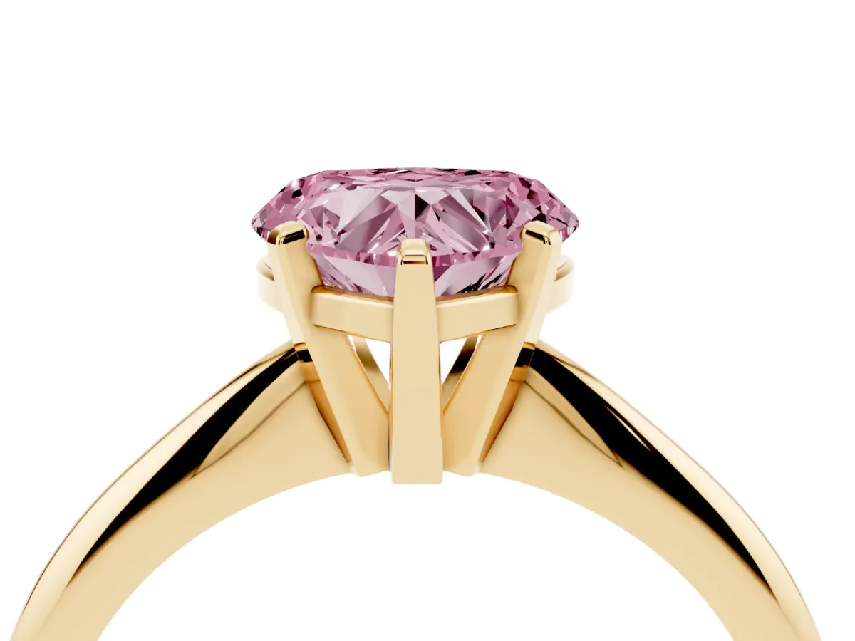 Fancy Pink Heart Cut Cut Solitaire Ring with Four-Prong Setting on a Classic Band Yellow gold