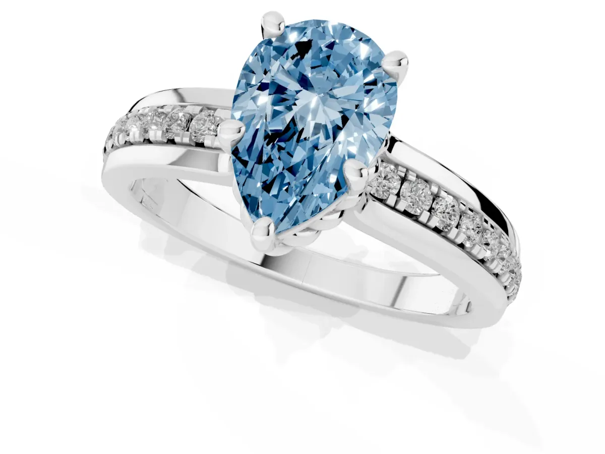 Fancy Blue Pear Cut Solitaire Diamond Ring with Channel Set Band and Six-Prong Setting Silver