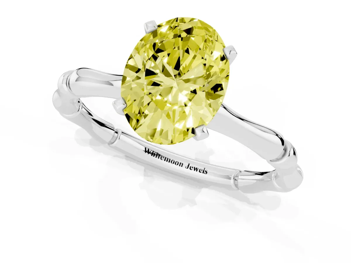 Fancy Yellow Oval Cut Solitaire Diamond Ring with Bamboo Band and Four-Prong Setting Silver