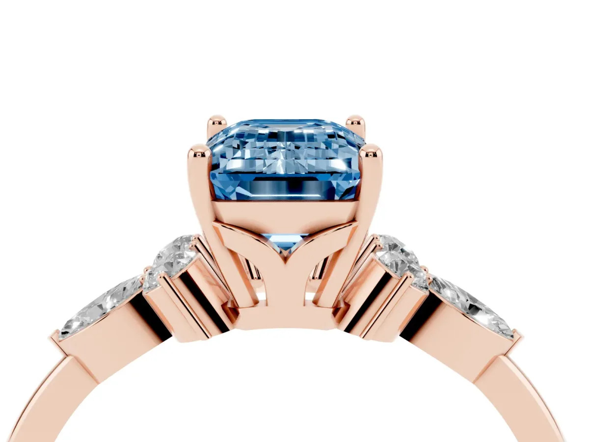 Fancy Blue Emerald Cut Brilliant Diamond Solitaire Ring with Pear Side Stones and Four-Prong Setting Rose gold