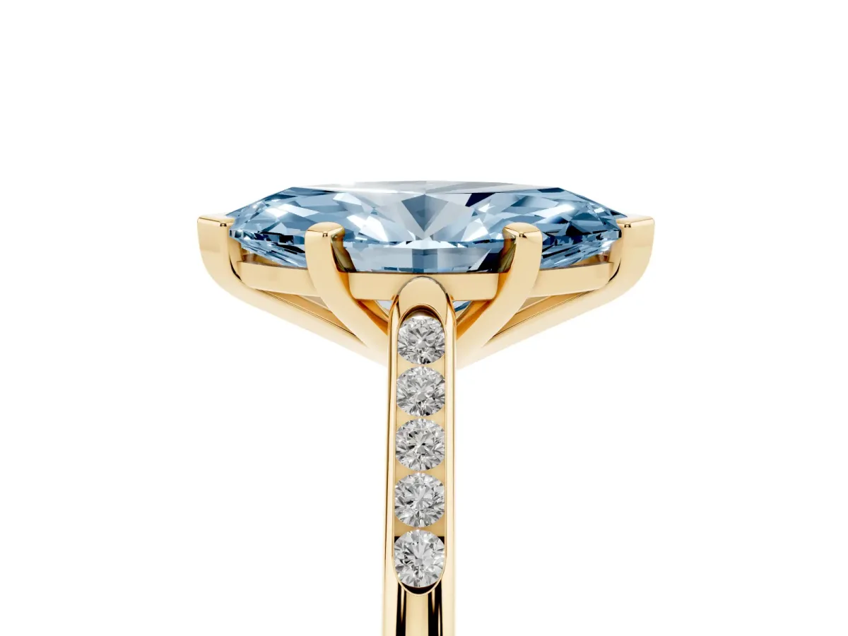 Fancy Blue Marquise Cut Diamond Solitaire Ring with Channel Set Round Band and Prong Setting Yellow gold