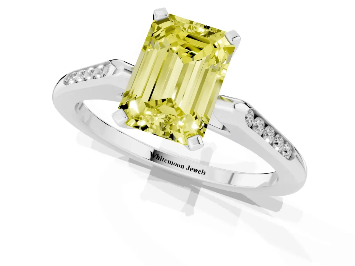 Fancy Yellow Emerald Cut Diamond Solitaire Ring with Channel Set Round Band and Prong Setting Silver