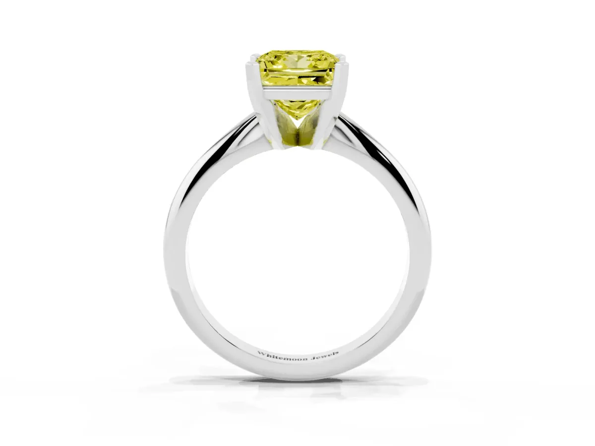 Fancy Yellow Princess Cut Cut Solitaire Ring with Four-Prong Setting on a Classic Band Silver