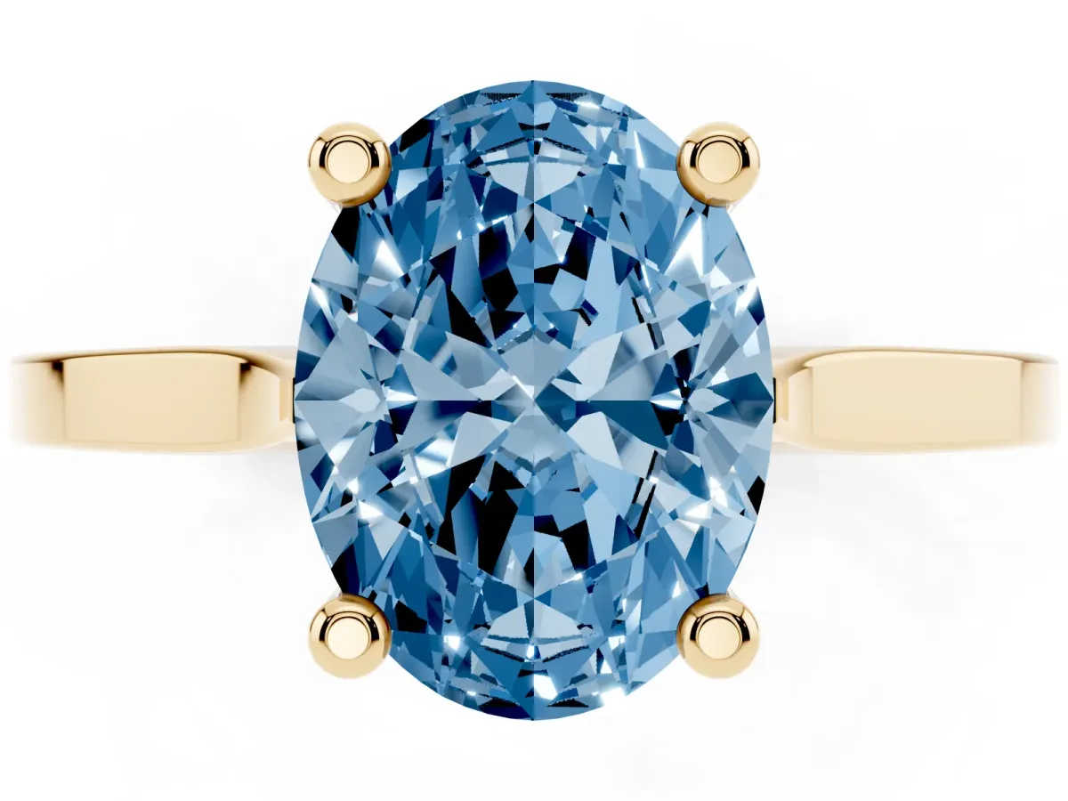 Fancy Blue Oval Cut Solitaire Diamond Ring with Four-Prong Setting and Tapered Band Yellow gold